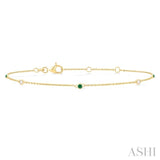 1.75 MM Emerald and 1/20 Ctw Round Cut Diamond Precious Station Bracelet in 14K Yellow Gold