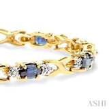 5x3 MM Oval Cut Sapphire and 1/10 Ctw Single Cut Diamond Bracelet in 10K Yellow Gold