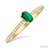 5x3 MM Oval Cut Emerald and 1/10 Ctw Petite Round Cut Diamond Precious Fashion Ring in 10K Yellow Gold