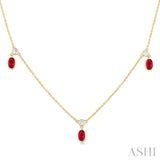 5x3 MM Oval Shape Ruby and 1/8 Ctw Round Cut Diamonds Precious Station Necklace in 10K Yellow Gold
