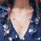 5x3 MM Pear Shape Ruby and 1/8 Ctw Round Cut Diamonds Precious Station Necklace in 10K Yellow Gold